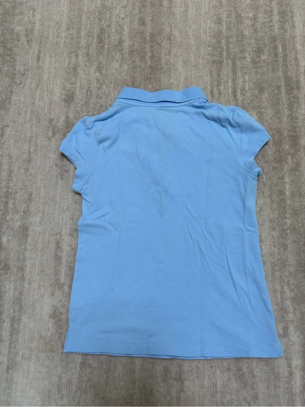 The Children's Place Light Blue Polo shirt with ruffle trim. Size M (7-8)
